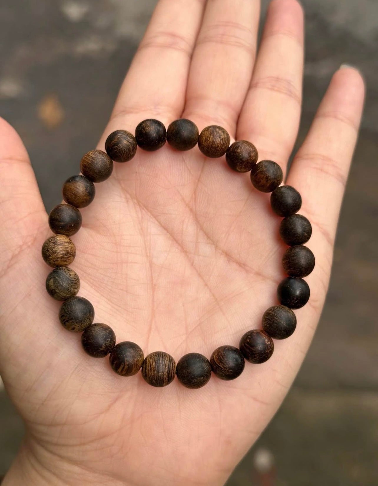 Agarwood Bracelet —specifically the one 21 dark-colored, 8mm round beads